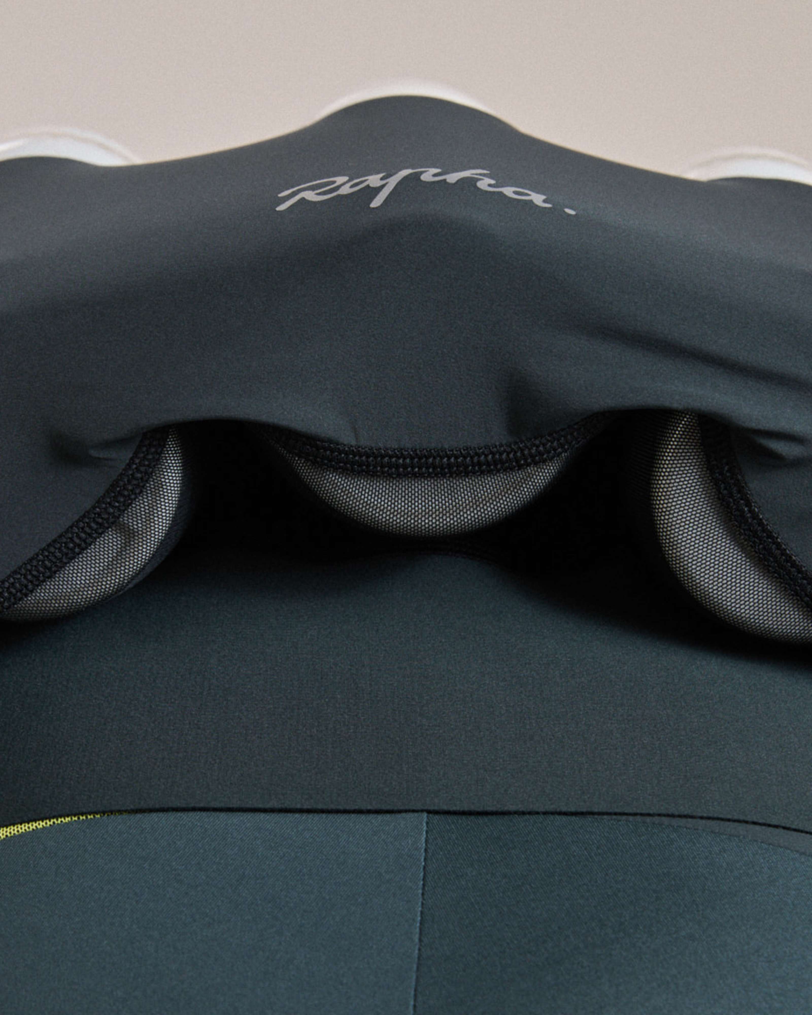 Mesh panel under pockets
